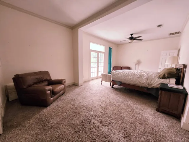 a bed room with furniture and a window