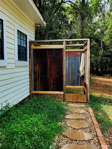 a view of a backyard with pathway