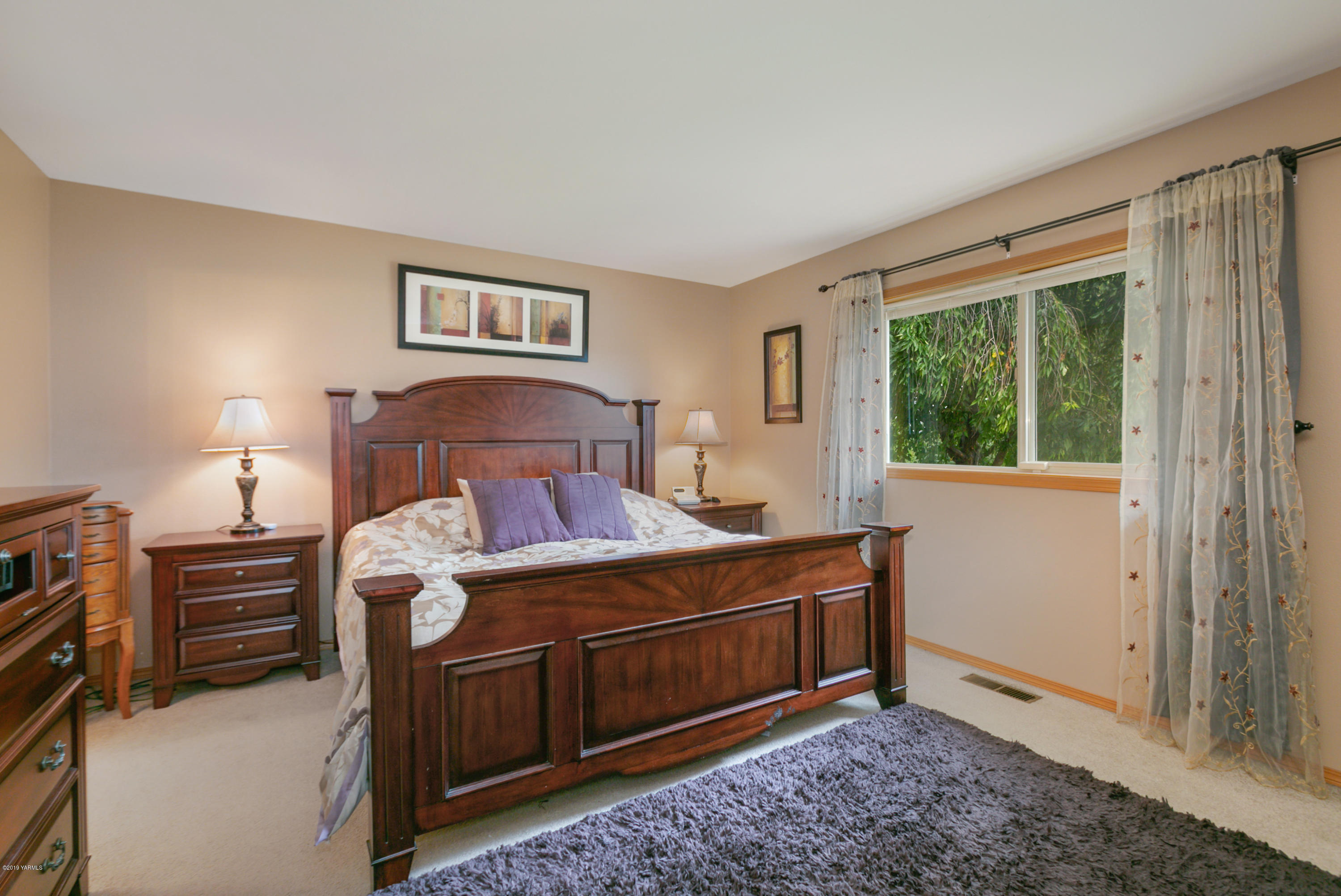 10501 Summitview Road Yakima, WA 98908 - Photo 15 of 22 a bedroom with a bed and a window