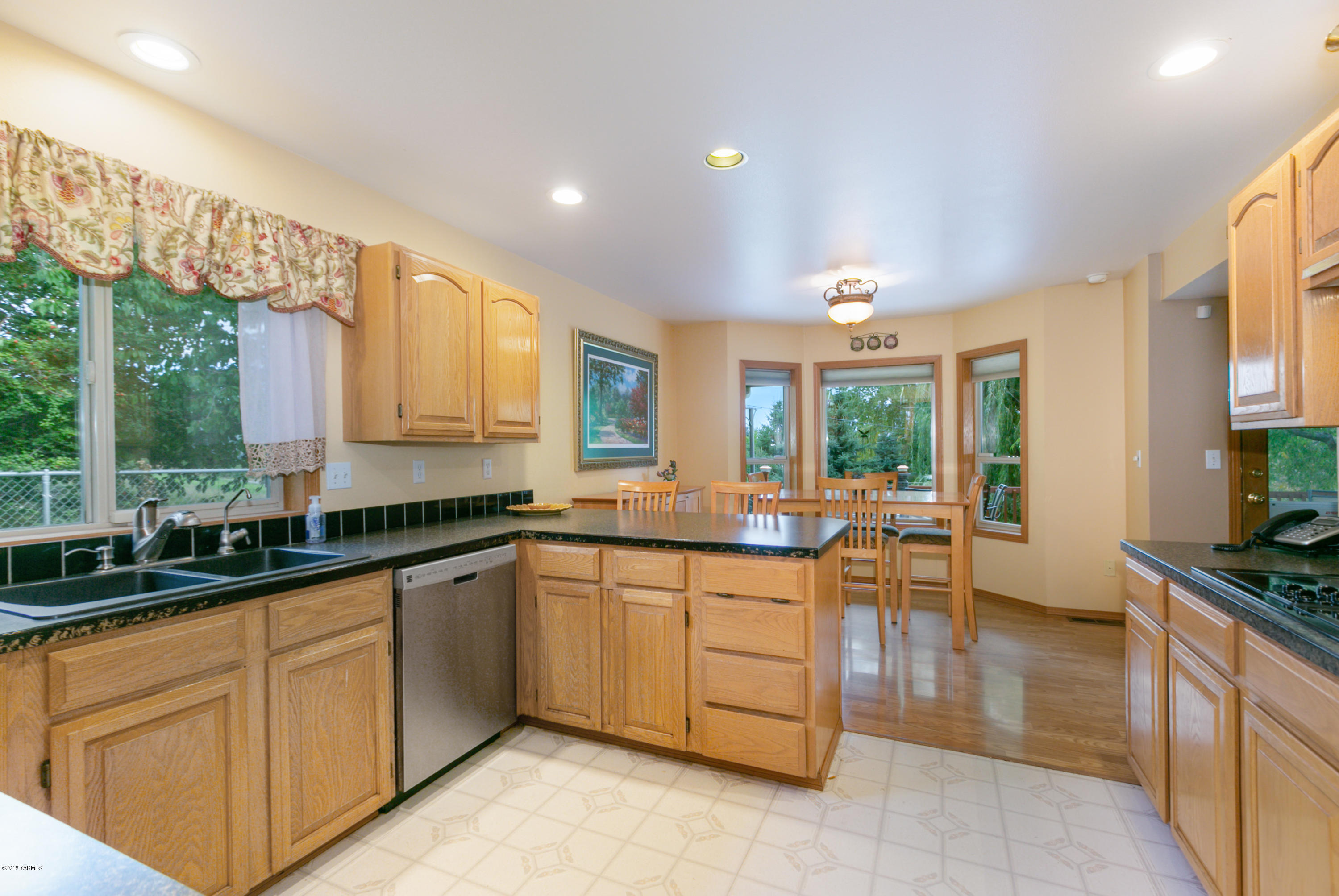 10501 Summitview Road Yakima, WA 98908 - Photo 9 of 22 a kitchen with lots of counter top space and living room