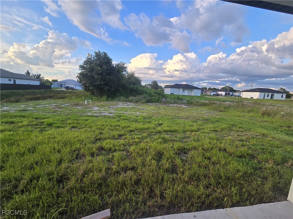 2822 19th Street Southwest Lehigh Acres, FL 33976 - Photo 21 of 23 a view of a field with an trees