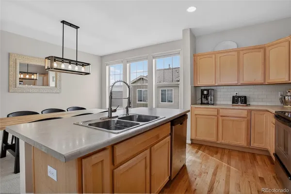 a view of a dining room with furniture and a chandelier