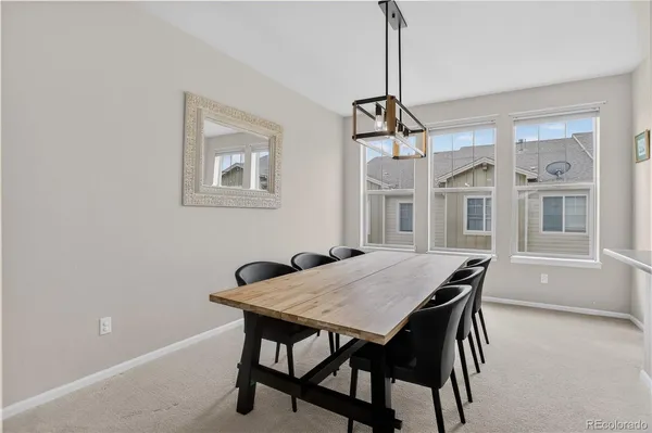 a bedroom with a bed a couch and dresser