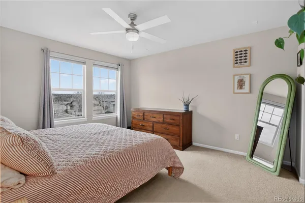 a bathroom with a double vanity sink toilet and a mirror