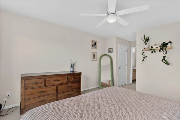 a white bath tub sitting next to a shower