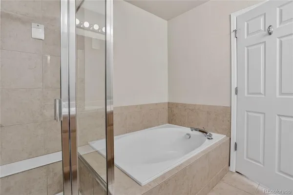 a bedroom with a bed a desk and chair