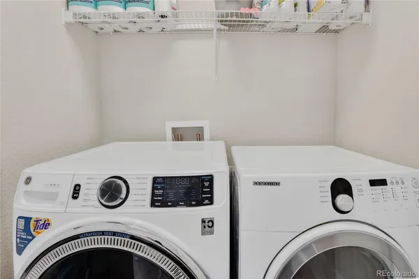 a bathroom with a sink toilet vanity and shower