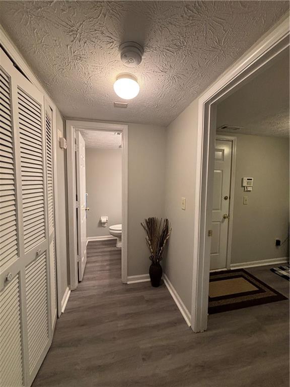 4949 Penscot Way Stone Mountain, GA 30088 - Photo 36 of 40 a view of a hallway with wooden floor and closet