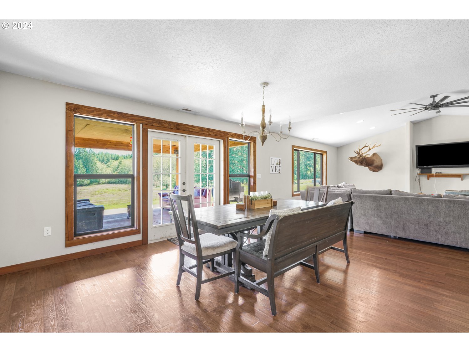 70200 Apiary Road Rainier, OR 97048 - Photo 14 of 37 a view of a dining room with furniture window and wooden floor