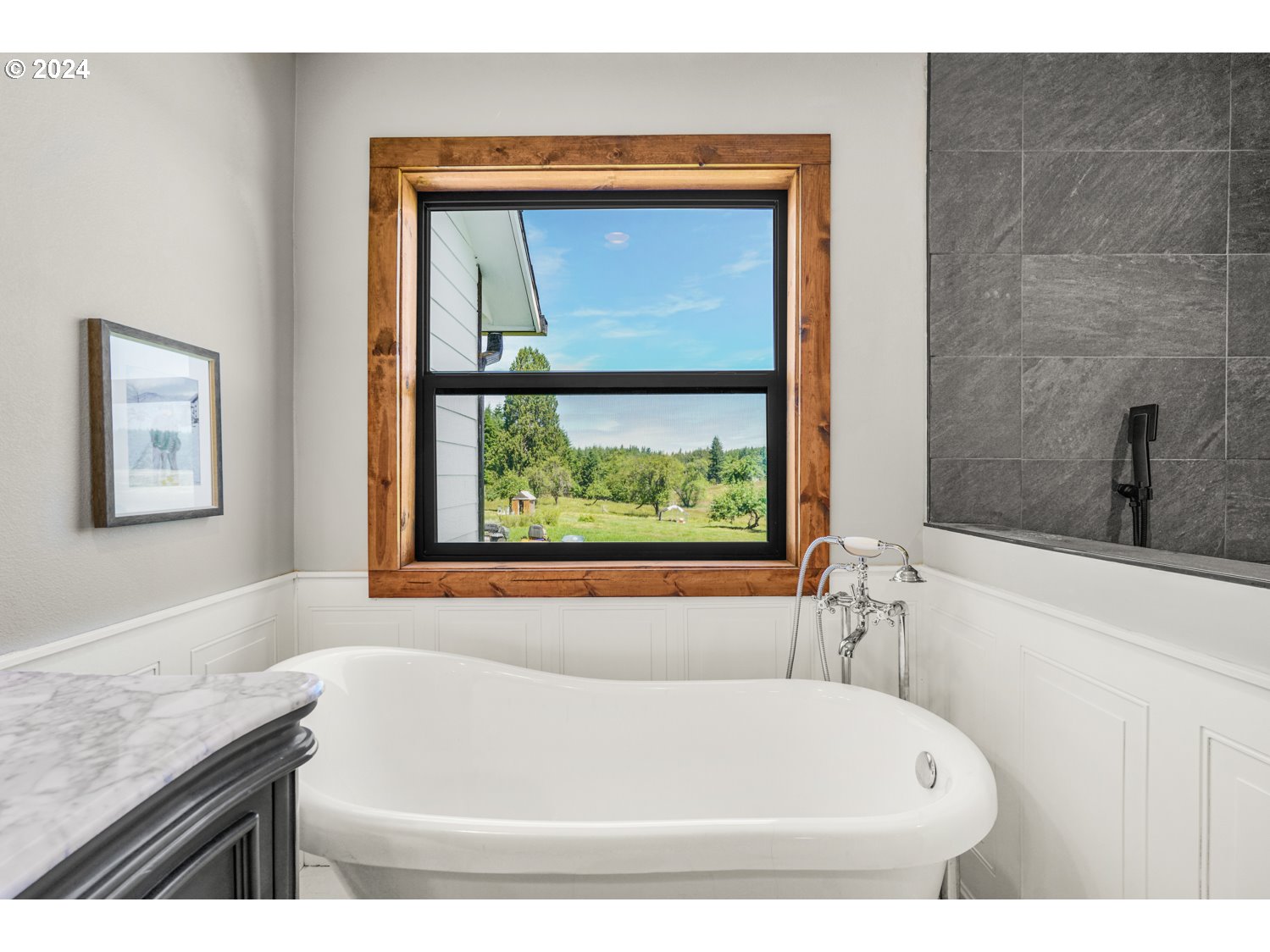 70200 Apiary Road Rainier, OR 97048 - Photo 18 of 37 a white bath tub sitting next to a window