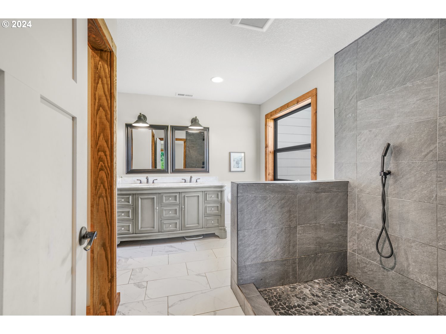70200 Apiary Road Rainier, OR 97048 - Photo 19 of 37 a bathroom with a granite countertop sink mirror and window