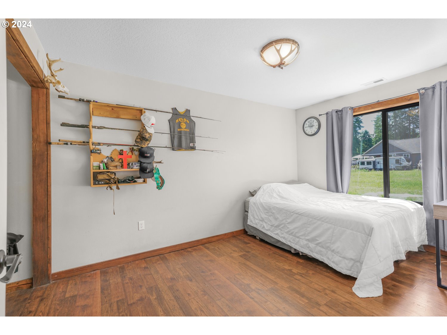 70200 Apiary Road Rainier, OR 97048 - Photo 20 of 37 a bedroom with a bed and a large window
