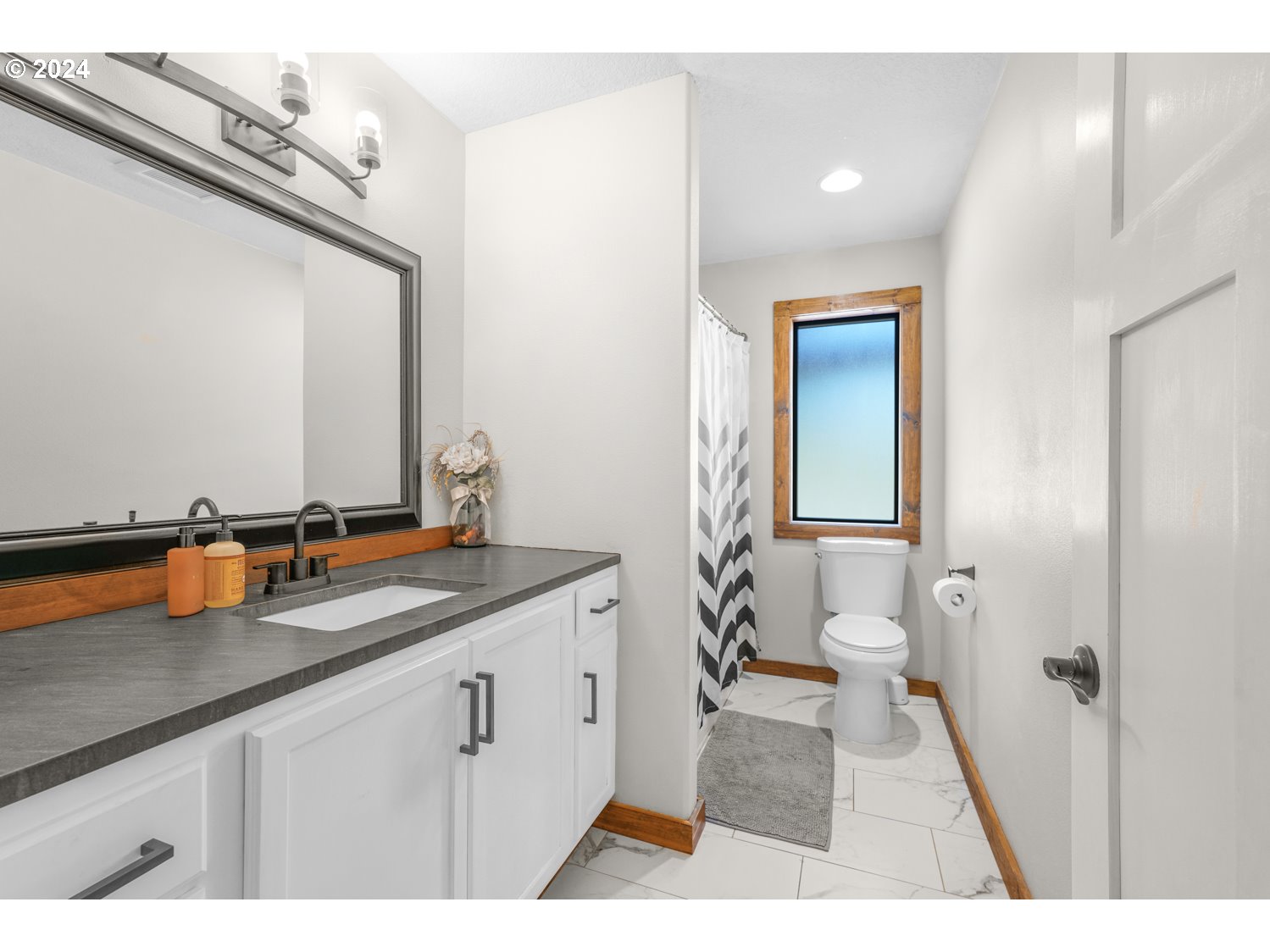 70200 Apiary Road Rainier, OR 97048 - Photo 22 of 37 a bathroom with a sink and a mirror