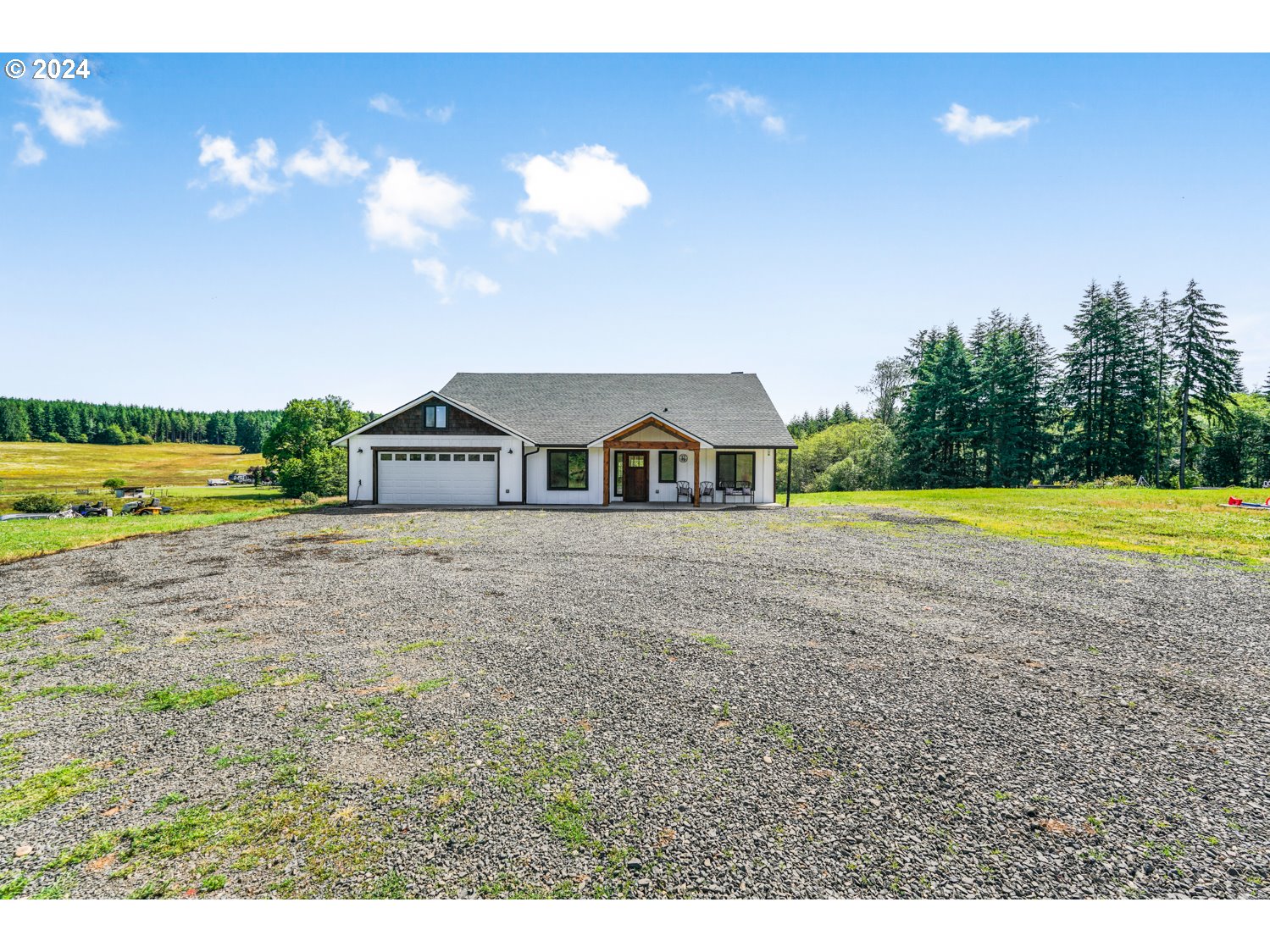 70200 Apiary Road Rainier, OR 97048 - Photo 30 of 37 a view of a house with a swimming pool and a yard