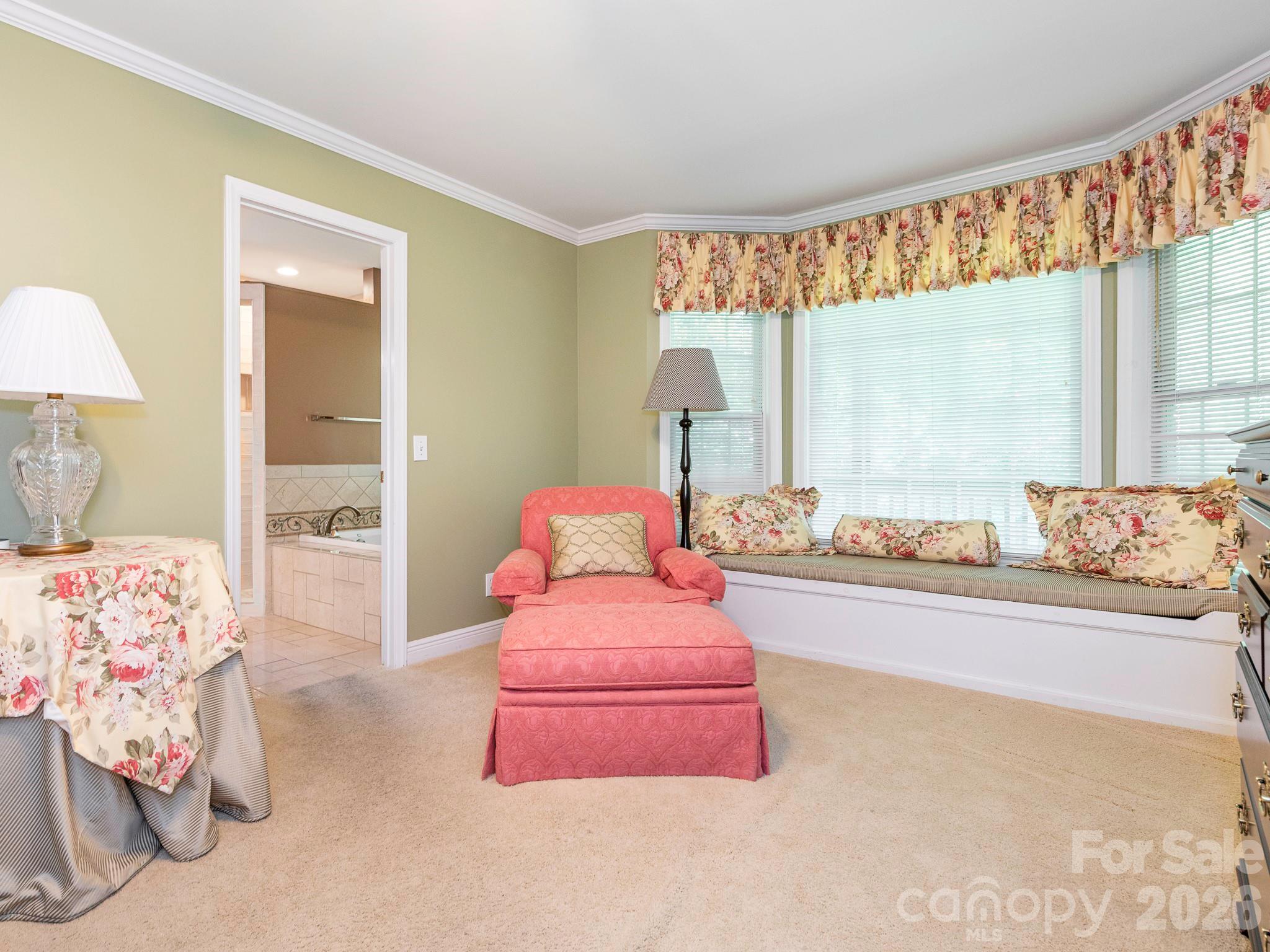 4440 Hucks Road Charlotte, NC 28269 - Photo 19 of 45 a bedroom with furniture and a large window