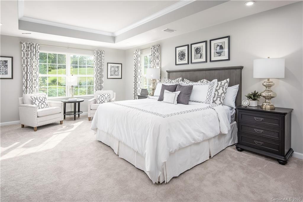 7129 Messina Road, Unit 131 Indian Land, SC 29707 - Photo 8 of 13 a bedroom with a bed and a couch
