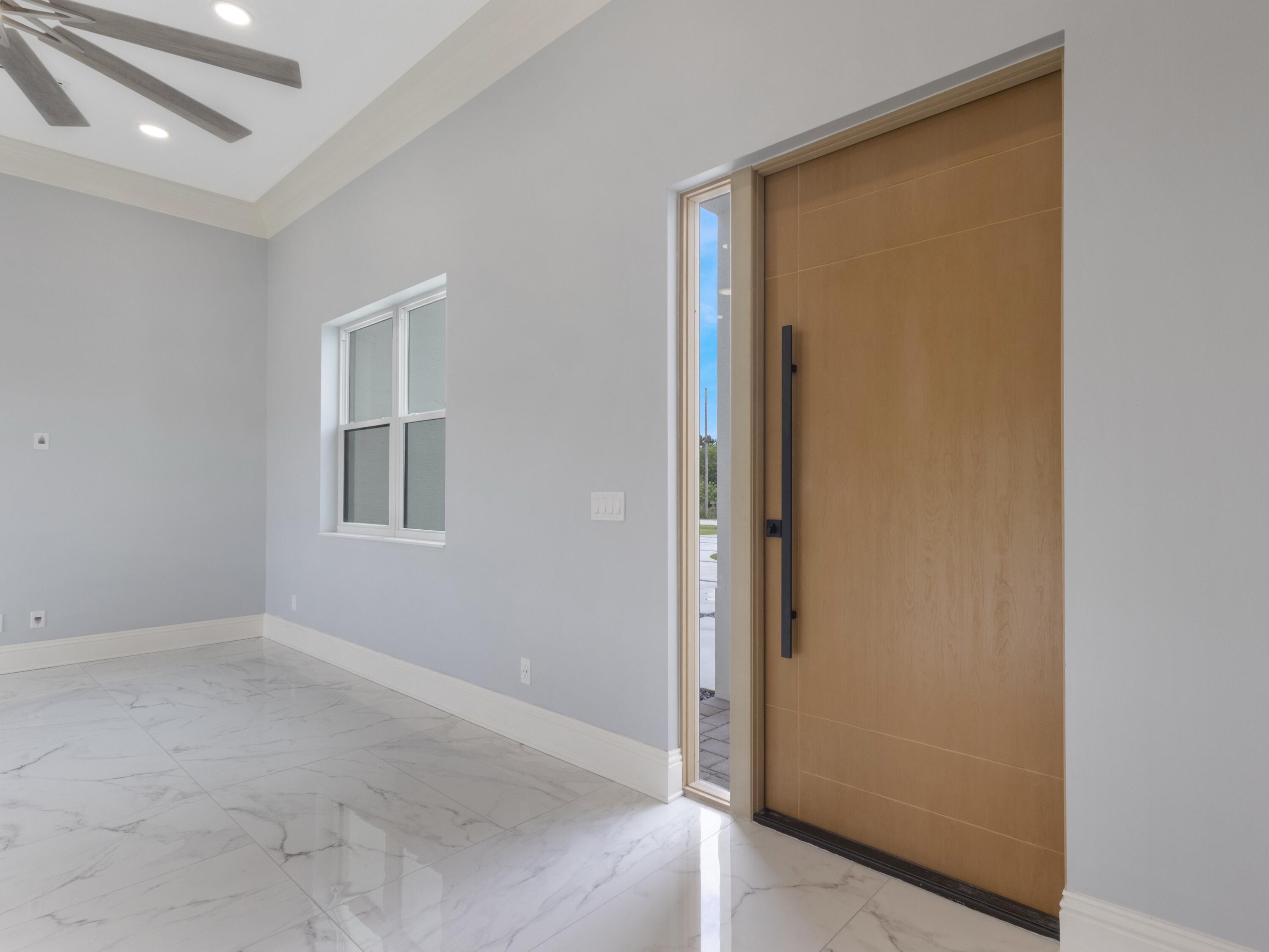 17436 71st Lane North Loxahatchee, FL 33470 - Photo 10 of 50 an empty room with windows and closet