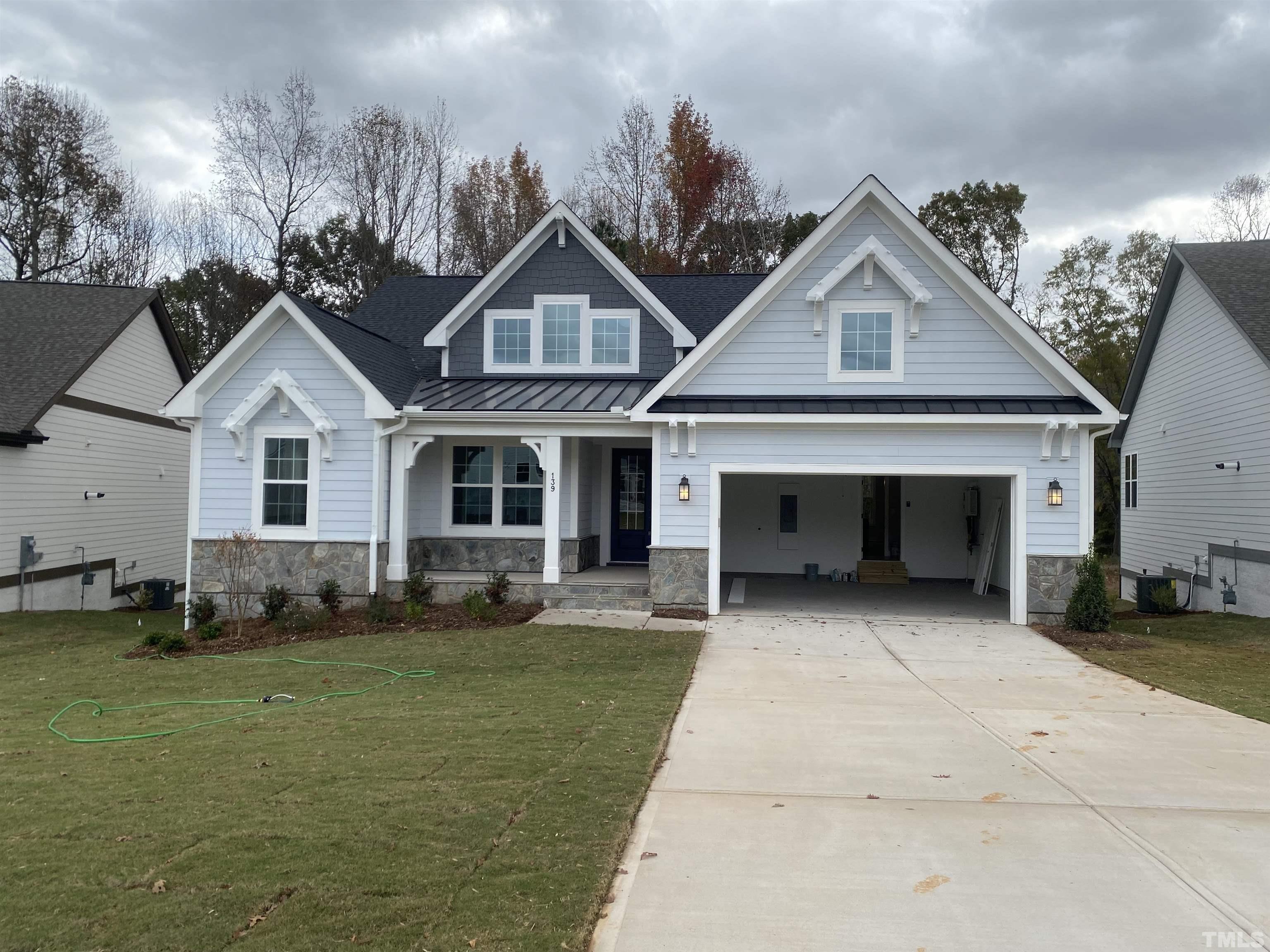 139 DUNLOE Loop Raleigh, NC 27603 - Photo 1 of 1 a front view of a house with a yard