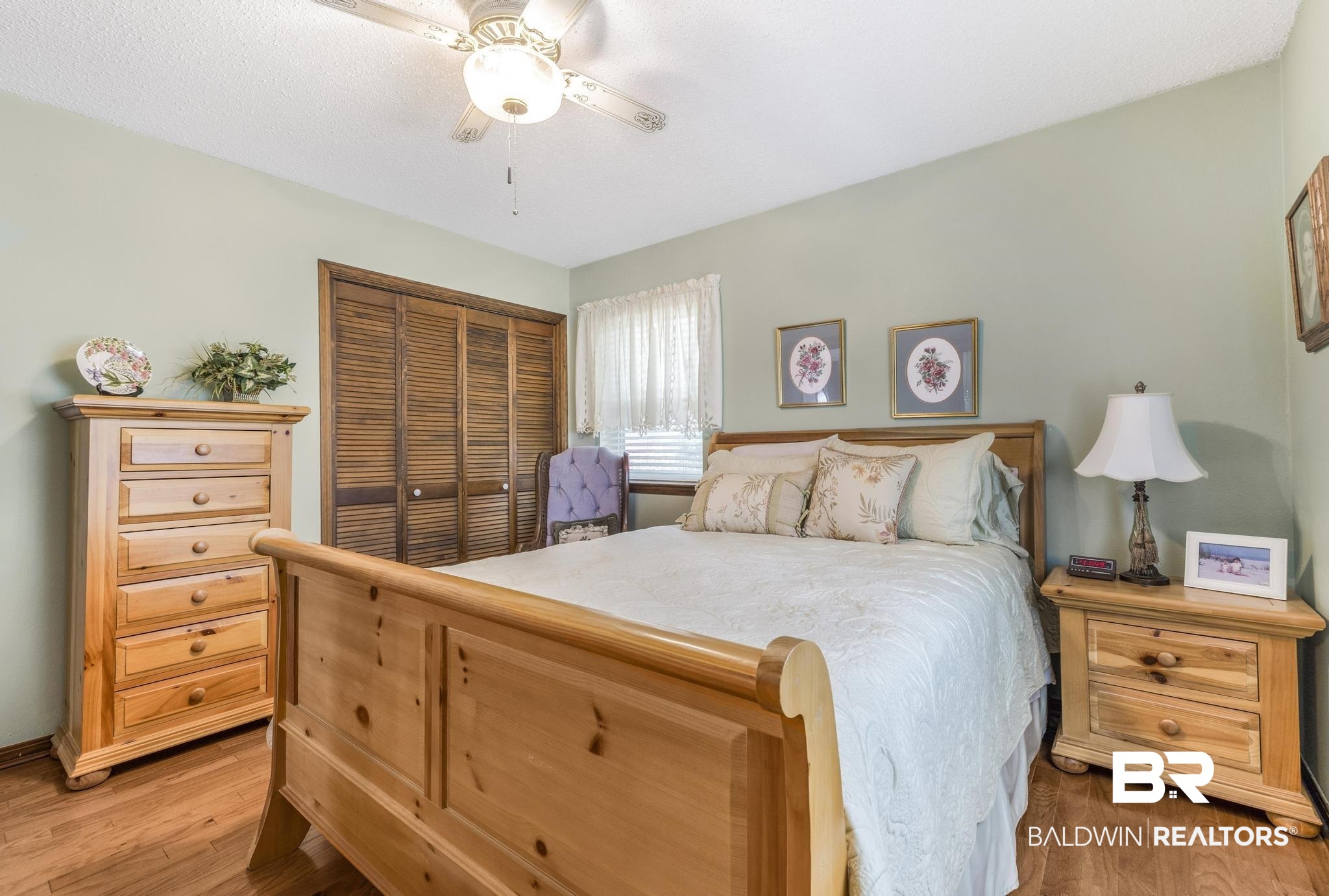 10207 Plantation Drive Daphne, AL 36526 - Photo 25 of 48 Bedroom with a closet, ceiling fan, and light wood-style flooring