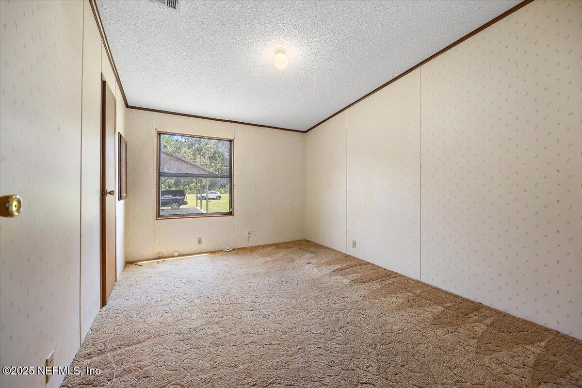 6370 CR 208 St. Augustine, FL 32092 - Photo 16 of 19 an empty room with windows