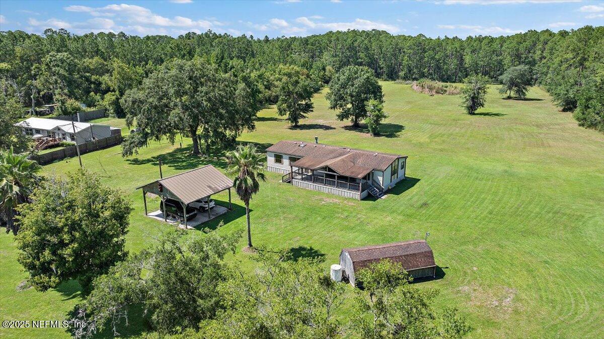 6370 CR 208 St. Augustine, FL 32092 - Photo 3 of 19 an aerial view of a house with garden space and street view