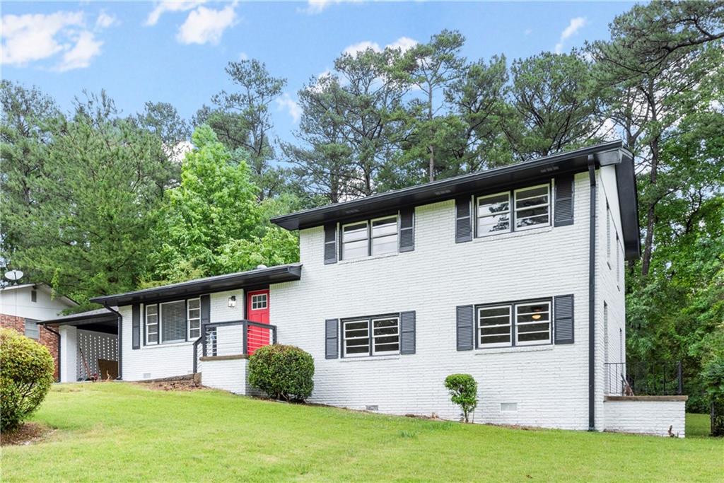 3219 Weslock Circle Decatur, GA 30034 - Photo 1 of 1 a front view of a house with a yard and trees