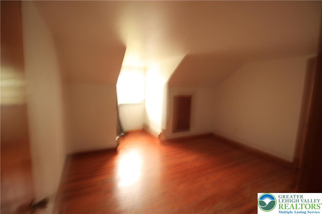 419 Diamond Street, Unit B Slatington, PA 18080 - Photo 12 of 17 a view of an empty room and wooden floor