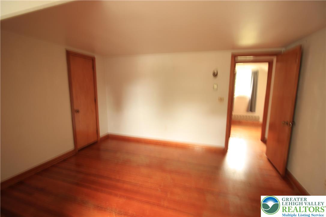 419 Diamond Street, Unit B Slatington, PA 18080 - Photo 13 of 17 a view of an empty room and wooden floor