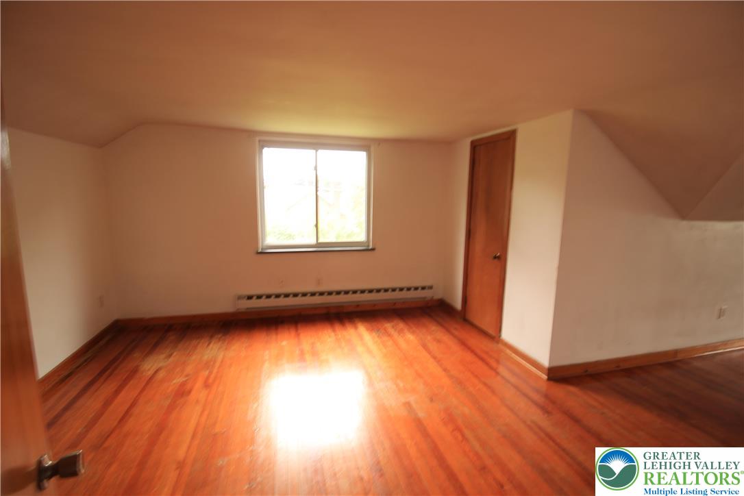 419 Diamond Street, Unit B Slatington, PA 18080 - Photo 9 of 17 a view of a room with wooden floor and window