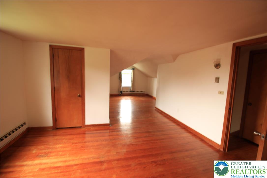 419 Diamond Street, Unit B Slatington, PA 18080 - Photo 10 of 17 a view of hallway with stairs and wooden floor