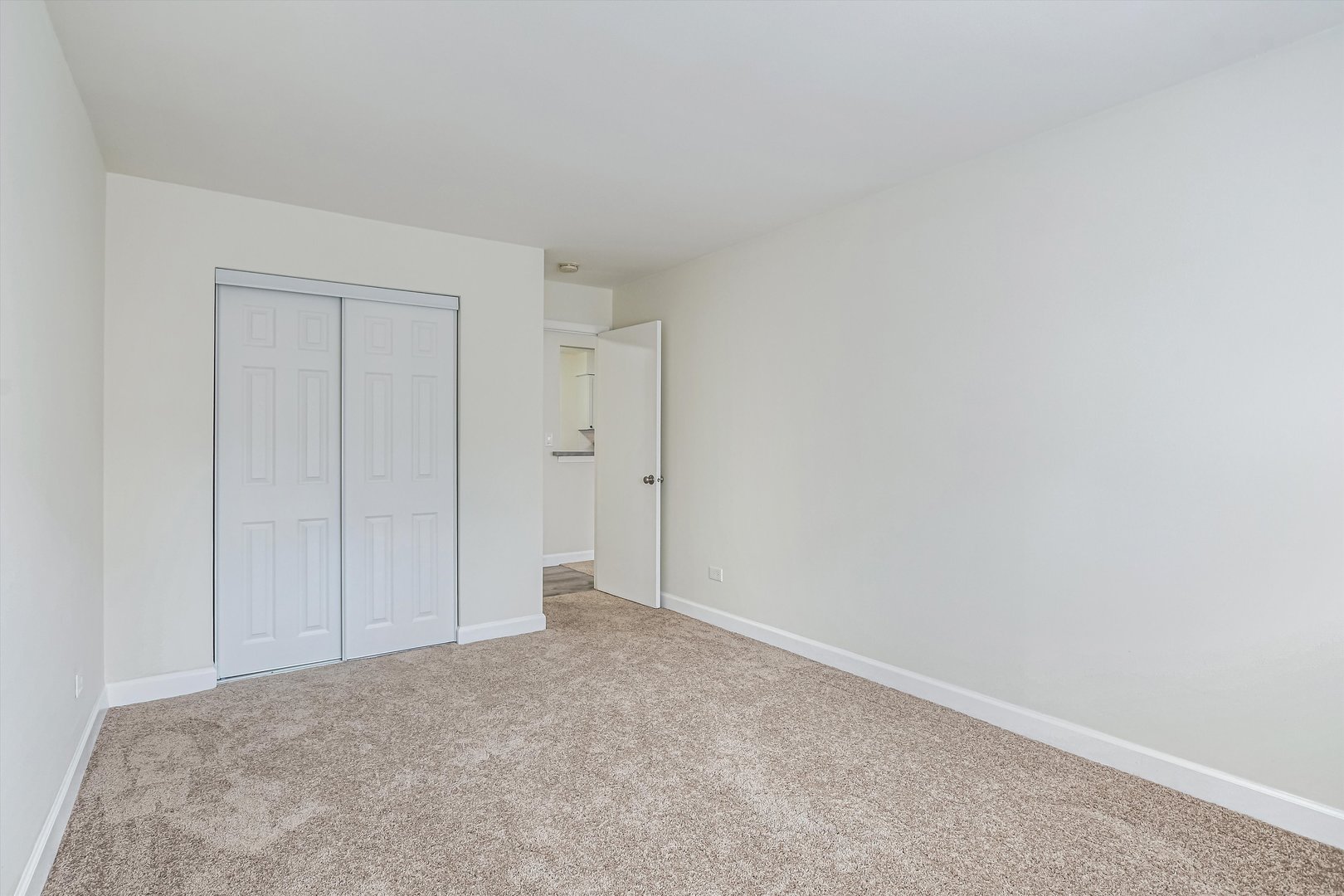 1039 College Avenue, Unit 2E Wheaton, IL 60187 - Photo 9 of 18 a view of an empty room and closet