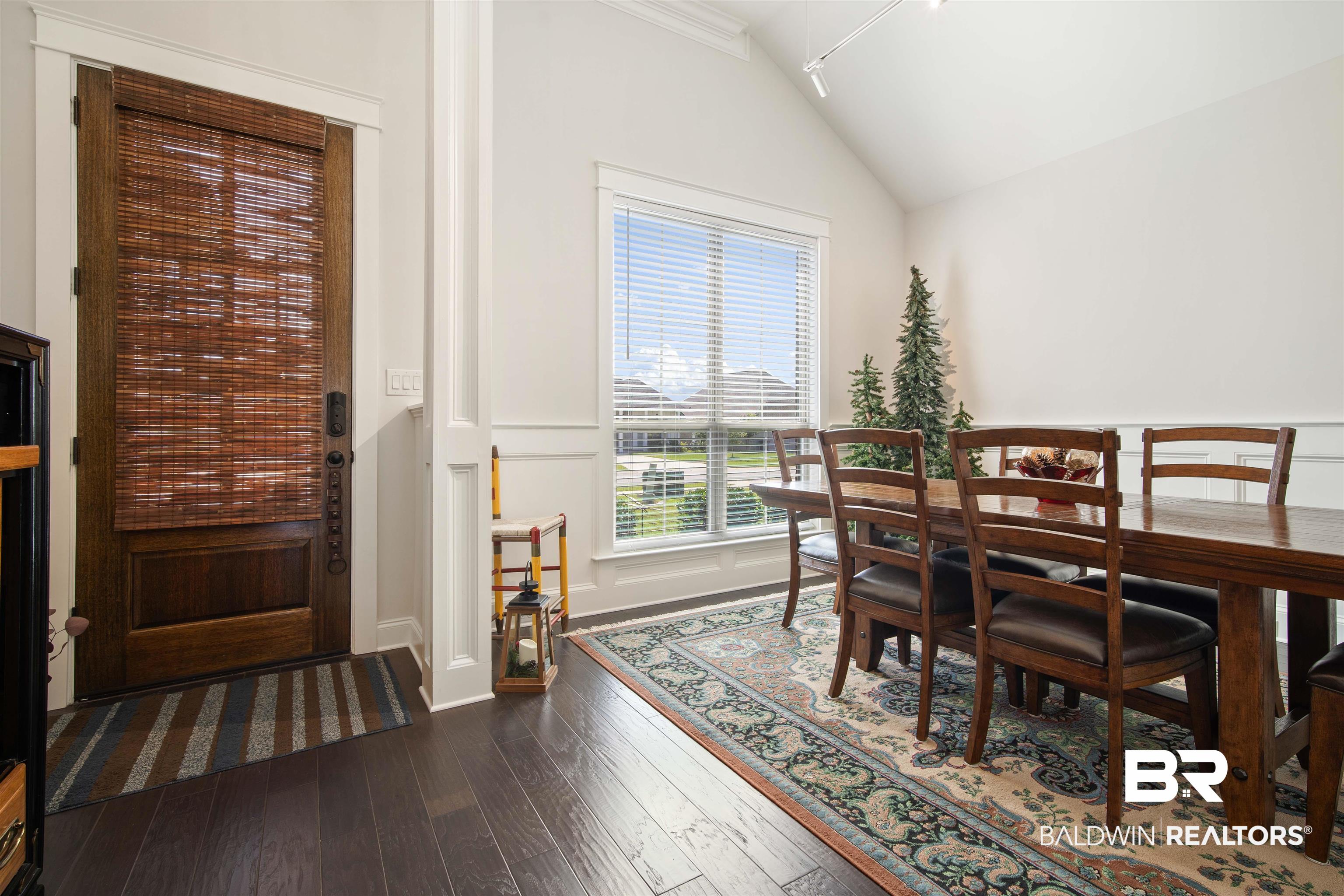 969 Charleston Loop Fairhope, AL 36532 - Photo 13 of 30 Dining area featuring lofted ceiling, track lighting, and wood-type flooring