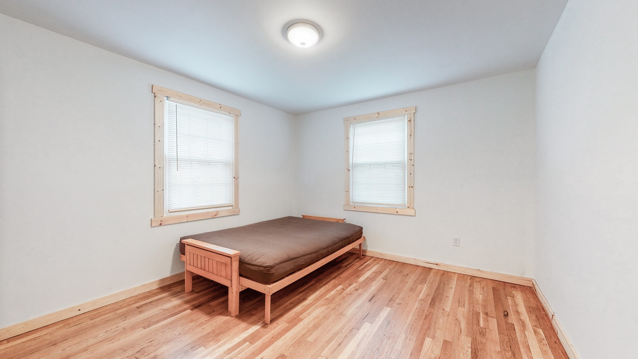 819 Neelys Bend Road Madison, TN 37115 - Photo 13 of 48 an empty room with a window and wooden floor
