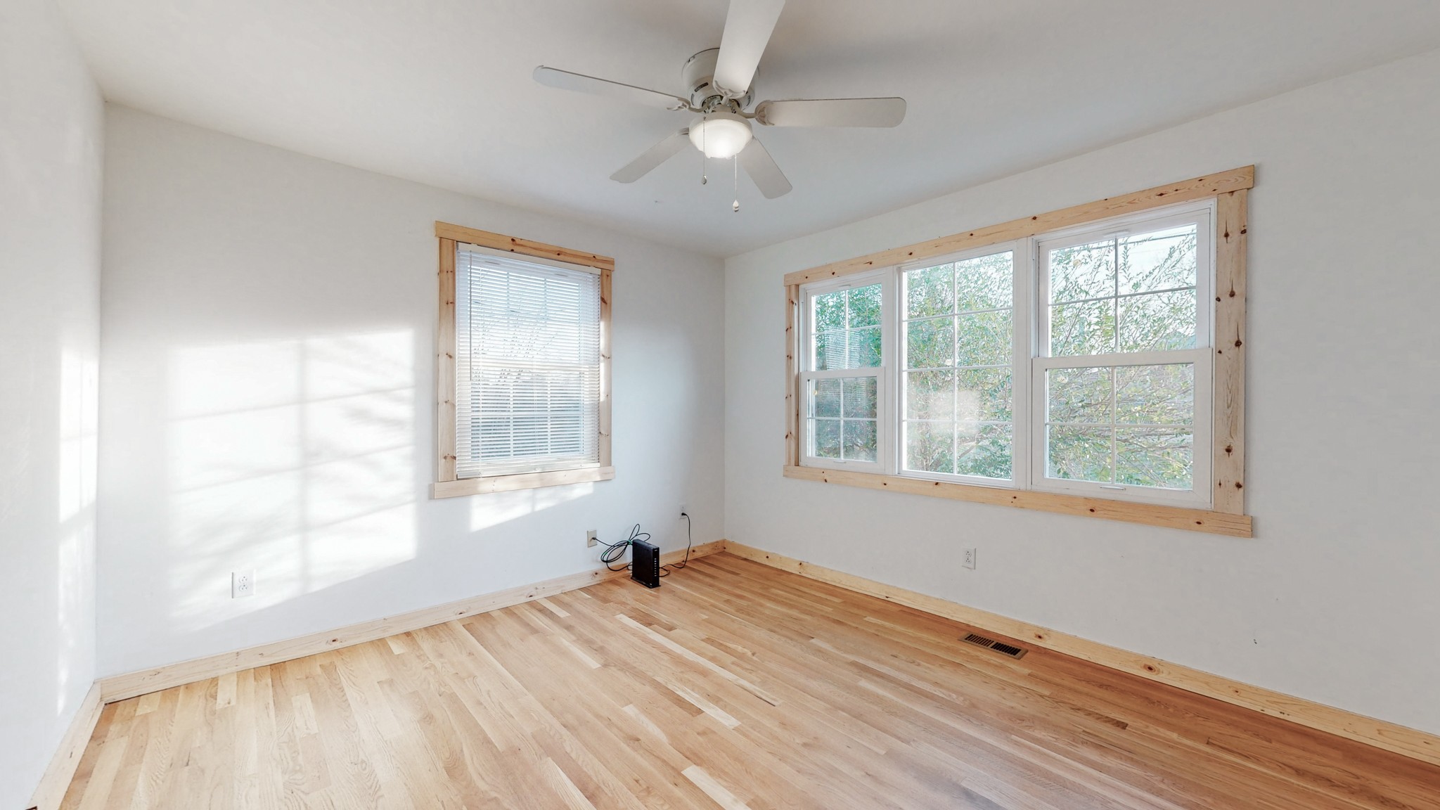 819 Neelys Bend Road Madison, TN 37115 - Photo 4 of 48 a view of empty room with wooden floor and fan