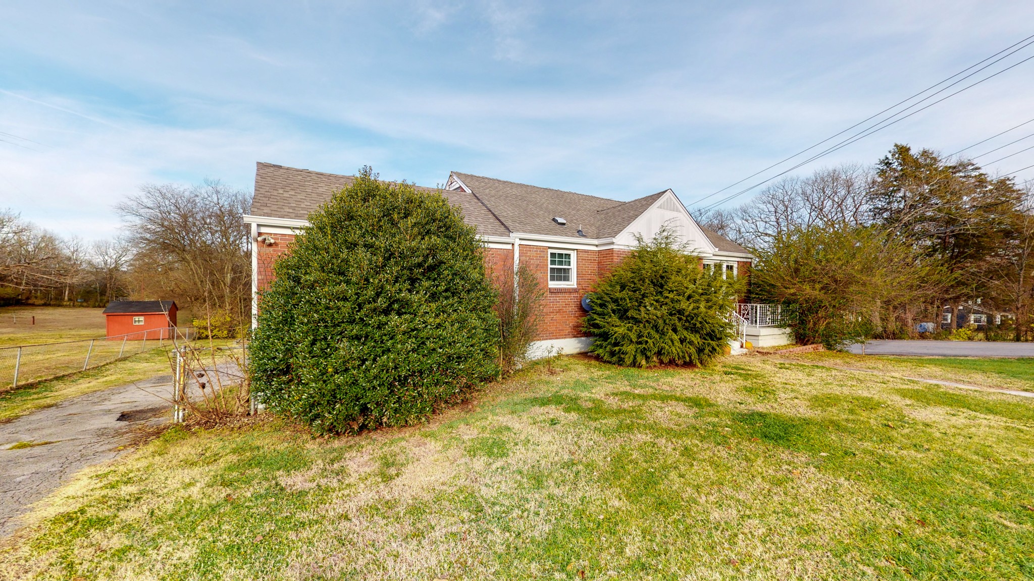 819 Neelys Bend Road Madison, TN 37115 - Photo 40 of 48 a view of a house with a big yard and large trees