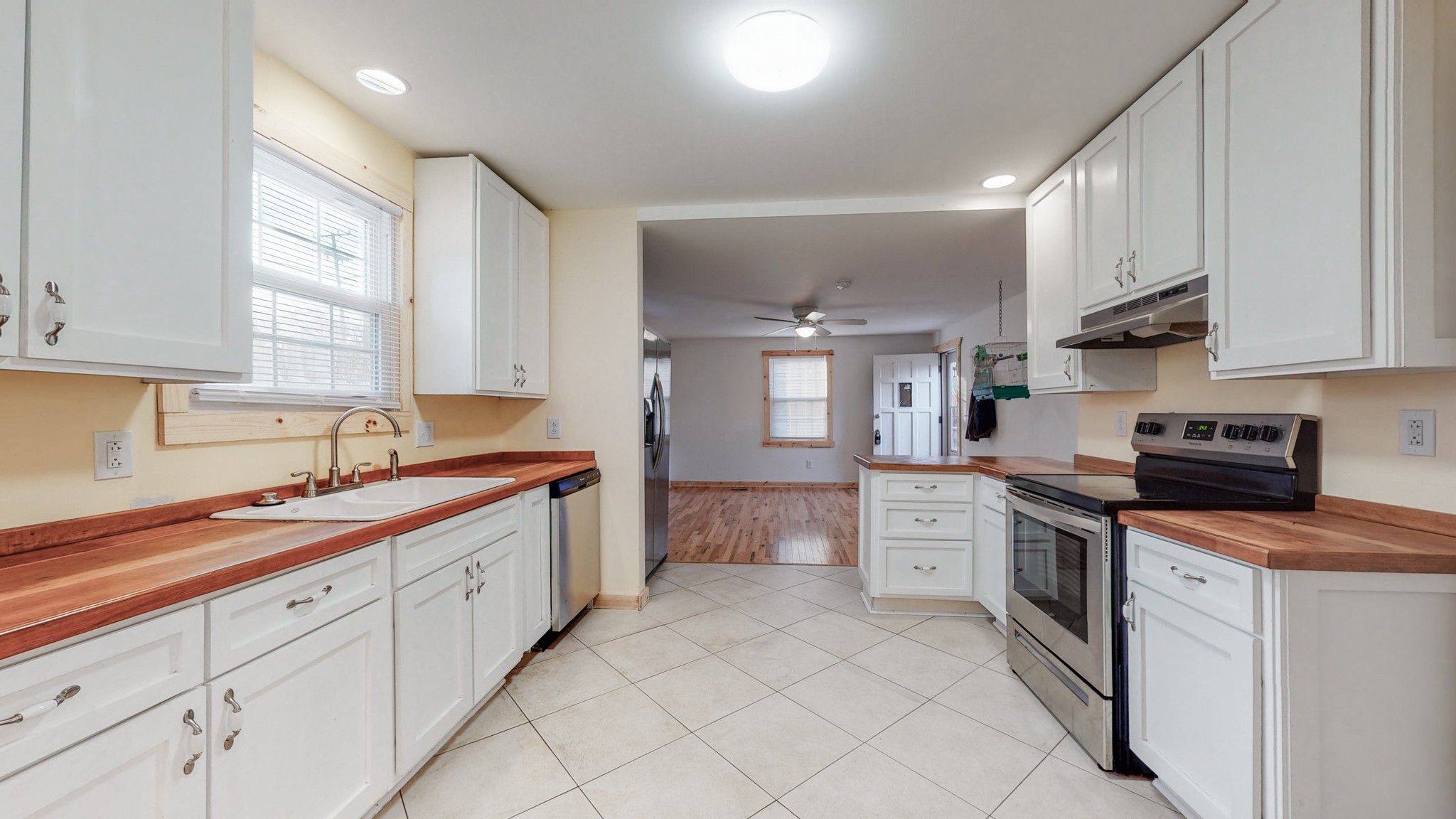 819 Neelys Bend Road Madison, TN 37115 - Photo 7 of 48 a kitchen with white cabinets and white appliances