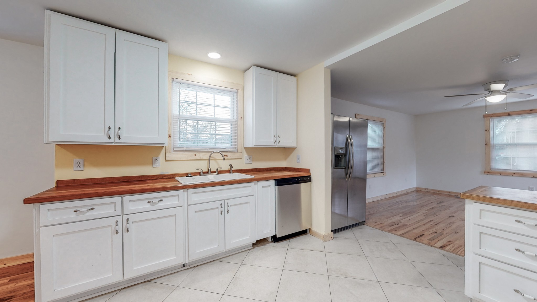 819 Neelys Bend Road Madison, TN 37115 - Photo 8 of 48 a kitchen with white cabinets appliances and a sink