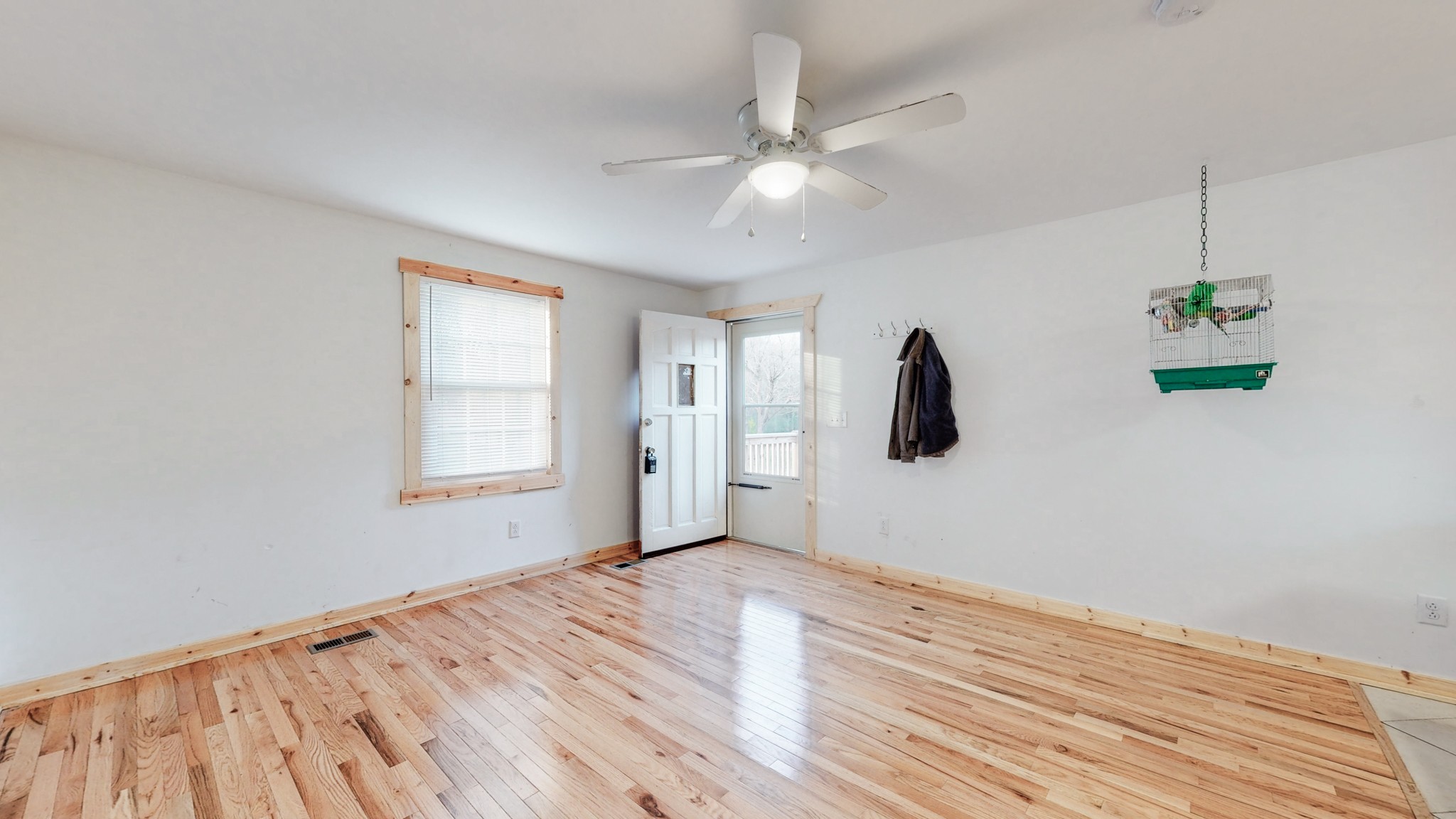 819 Neelys Bend Road Madison, TN 37115 - Photo 10 of 48 a view of an empty room with wooden floor and a window