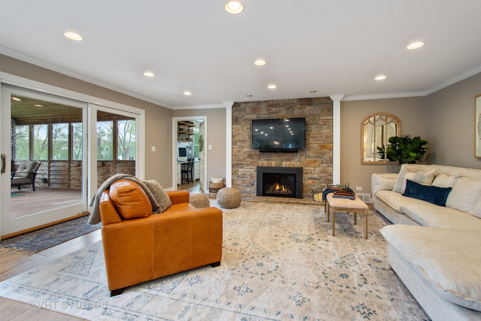 415 North Valley Road Barrington, IL 60010 - Photo 7 of 36 a living room with furniture a flat screen tv and a fireplace