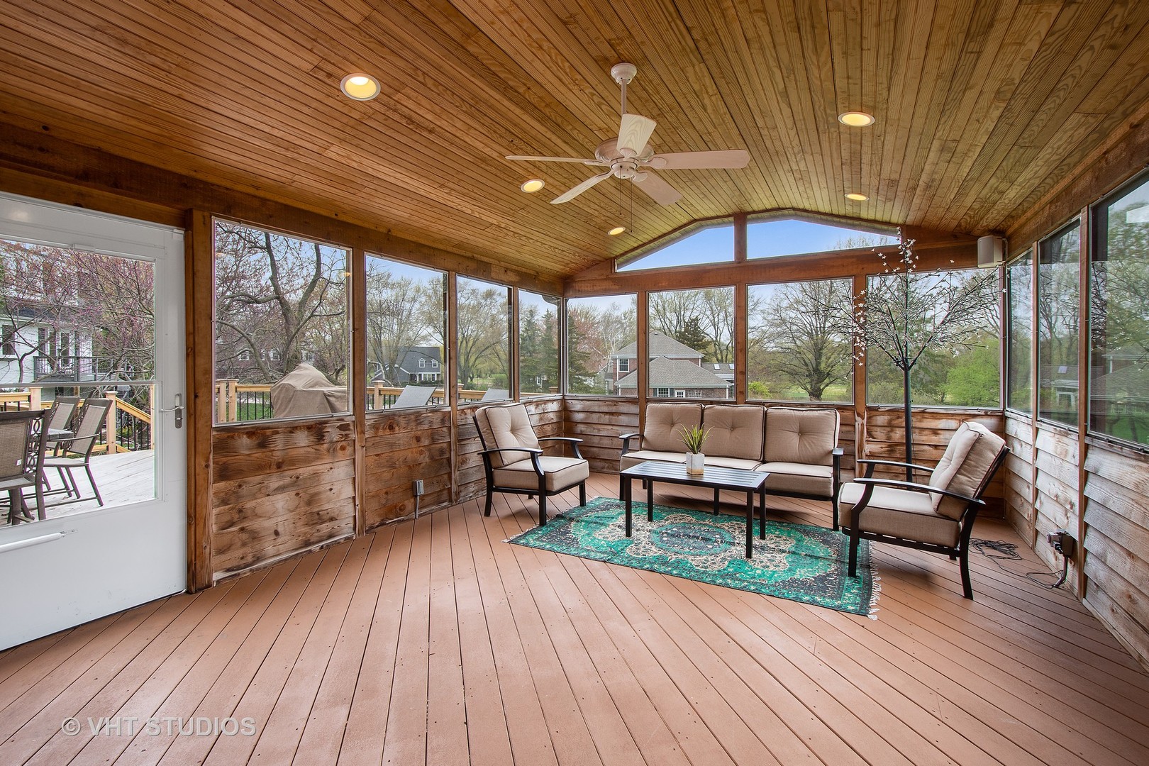 415 North Valley Road Barrington, IL 60010 - Photo 9 of 36 a view of a patio with table and chairs potted plants with wooden floor and floor to ceiling window
