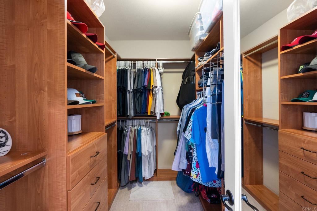 809 Dolphin Circle Encinitas, CA 92024 - Photo 42 of 71 a view of walk in closet with clothes and shoes