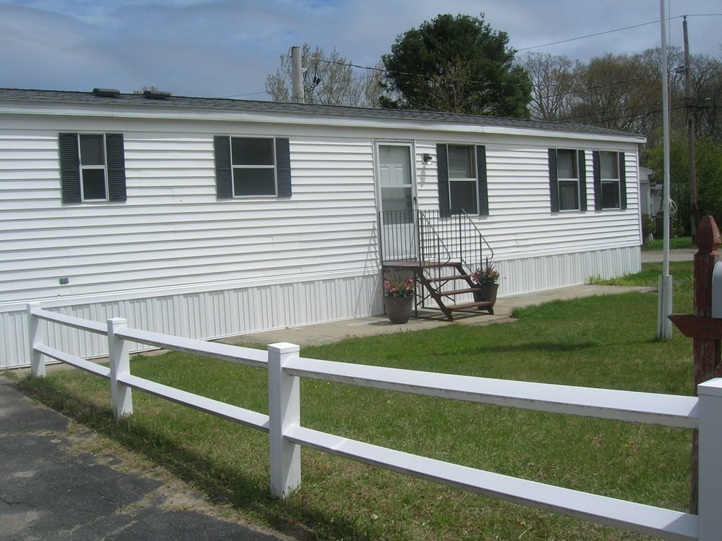 8 Willow Terrace Taunton, MA 02780 - Photo 2 of 14 a front view of a house with a yard