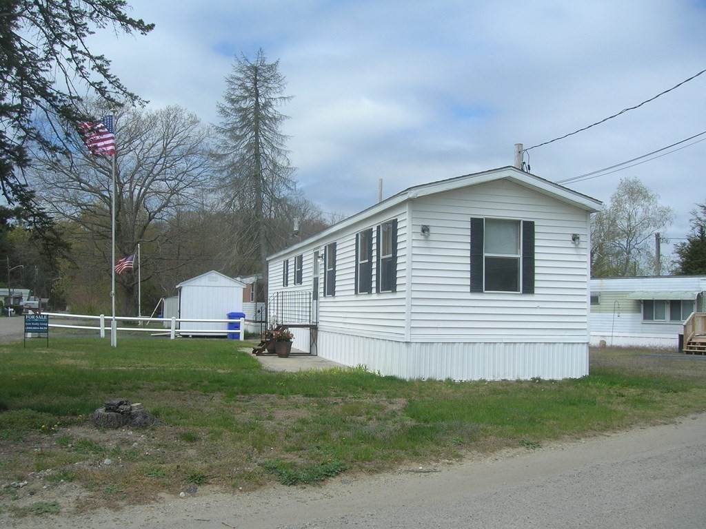 8 Willow Terrace Taunton, MA 02780 - Photo 3 of 14 a front view of a house with a yard