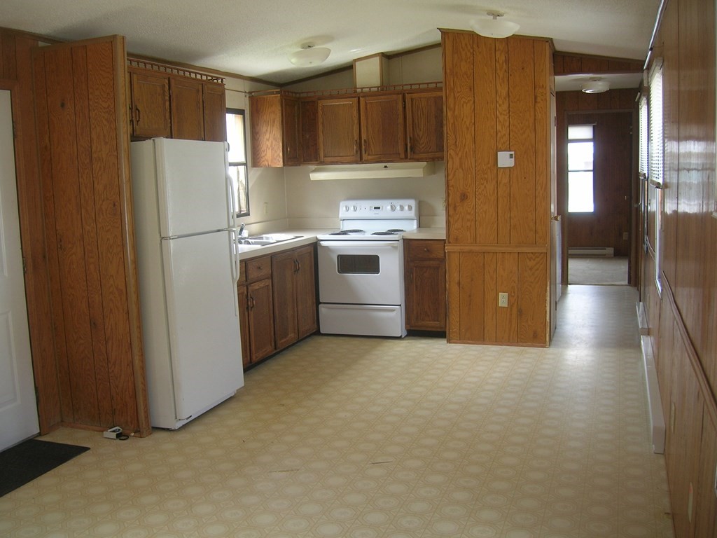 8 Willow Terrace Taunton, MA 02780 - Photo 7 of 14 a kitchen with a refrigerator sink and cabinets