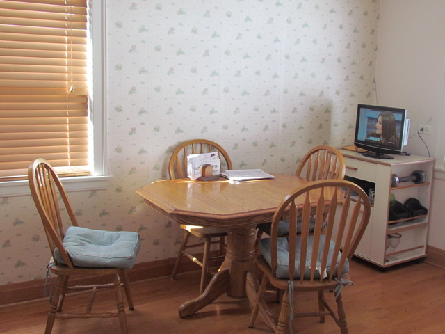 6952 West Foster Avenue Chicago, IL 60656 - Photo 6 of 14 a view of a dining room with furniture and window