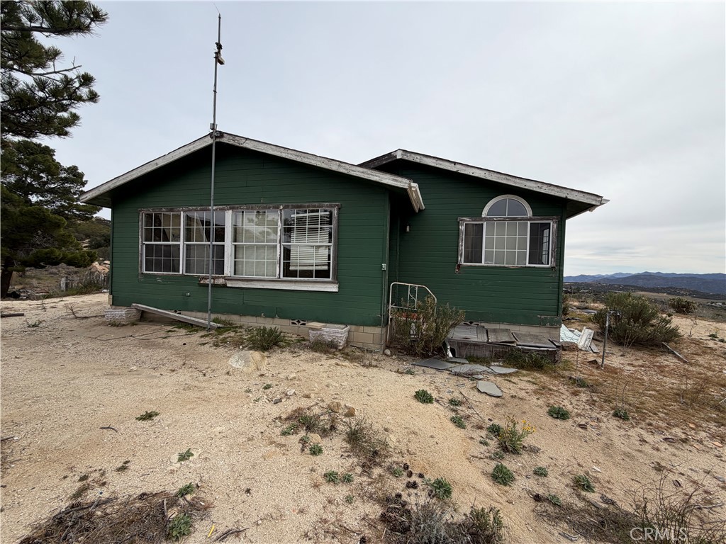 61200 Indian Paint Brush Road Anza, CA 92539 - Photo 37 of 73 a front view of a house with garden