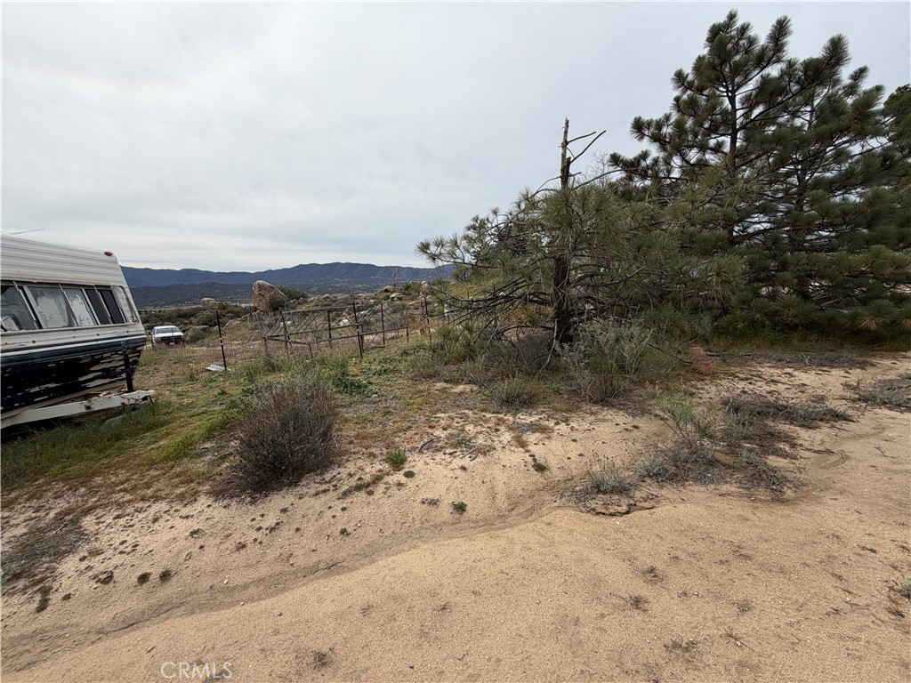 61200 Indian Paint Brush Road Anza, CA 92539 - Photo 56 of 73 a view of a dry yard with wooden fence