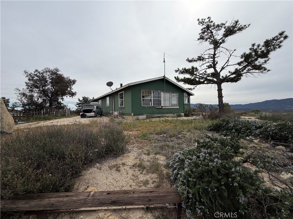 61200 Indian Paint Brush Road Anza, CA 92539 - Photo 61 of 73 a front view of a house with garden