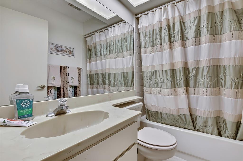 2111 Forester Way Spring Hill, FL 34606 - Photo 16 of 33 a bathroom with a sink a toilet and shower