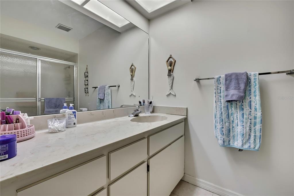 2111 Forester Way Spring Hill, FL 34606 - Photo 22 of 33 a bathroom with a sink and a mirror